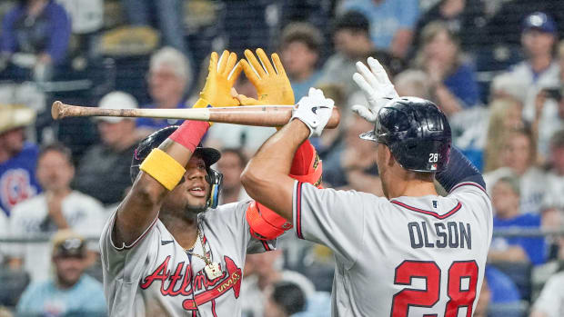 Apr 14, 2023; Kansas City, Missouri, USA; Atlanta Braves right fielder Ronald Acuna Jr. (13) celebrates with first baseman Matt Olson (28) after hitting a solo home run against the Kansas City Royals in the sixth inning at Kauffman Stadium.